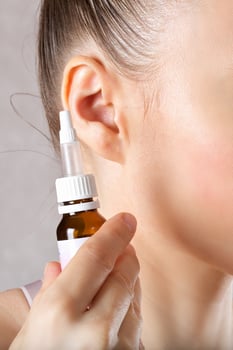 Ear of a young caucasian lady. Closeup photo