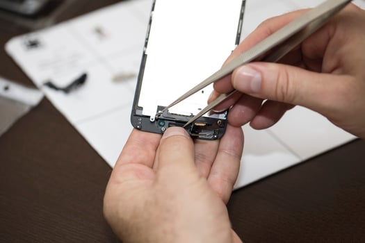 Process of replacing damaged screen glass at smartphone. photo