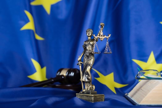 Statue of Themis on a flag of European Union. photo