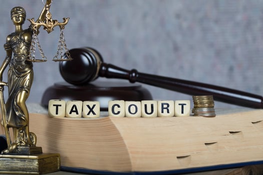 Words TAX COURT composed of wooden letters. photo