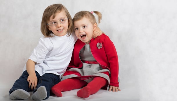 Boy of five years and girl of 2 years are sitting together. photo