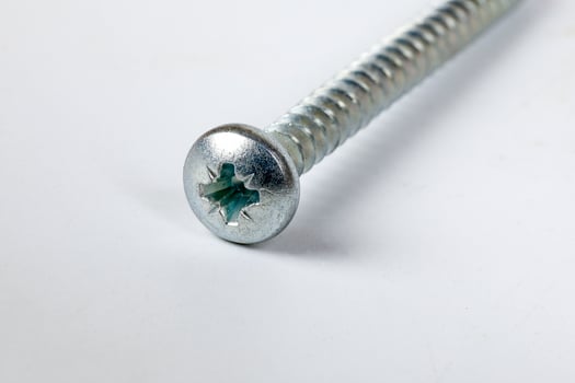 Metal screw plug on white background photo
