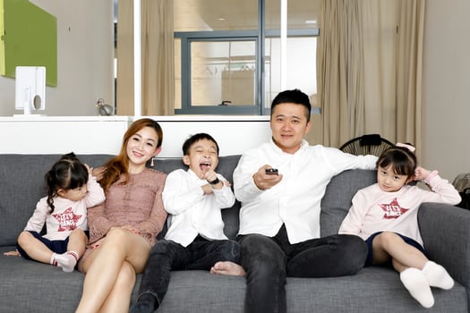 Parents Child Family father mother daughter son sit on sofa watching television entertainment photo