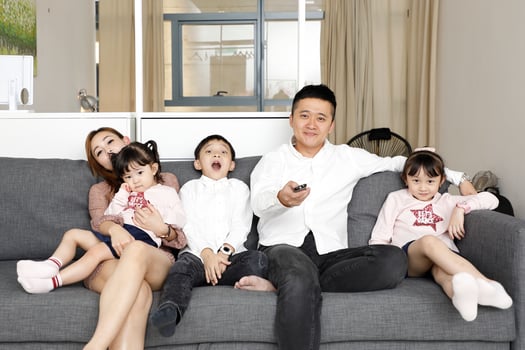 Parents Child Family father mother daughter son sit on sofa watching television entertainment photo
