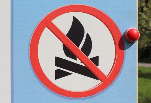 No camp fire sign. Sign which shows its prohibited to make a fire here. Bush fire season - no open flame out doors. No fire on the beach. Light cold colors - clear sign. High resolution image photo