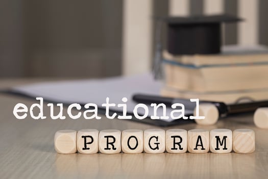 Words  EDUCATIONAL PROGRAM composed of wooden dices. photo