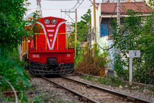 Incredible view of train passing through a narrow street, the Hanoi Old Quarter. Stock photo