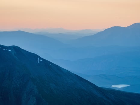 Beautiful mountain landscape with of sunset sky of pink orange lilac violet magenta colors. Colorful smooth dawn sky gradient. Nature background of sunrise. Amazing morning heaven. photo
