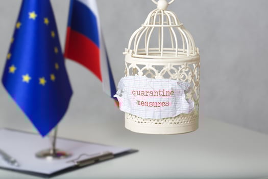 The small cage and the words QUARANTINE MEASURES attached to it. photo