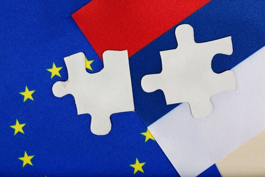 Two pieces of puzzle on European and Russian flag. Background photo