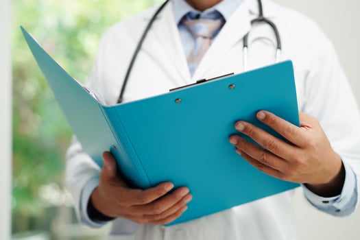 Asian man doctor study document to research method and technic for treating patients. photo