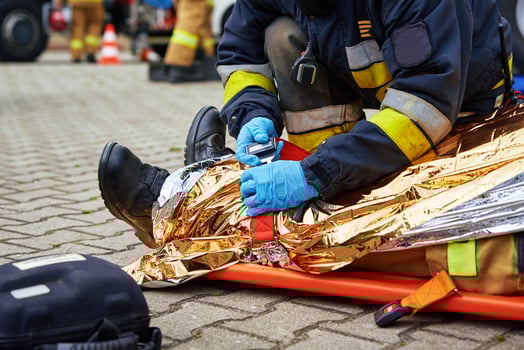 Rescuers provide first aid to the victim during car road accident photo