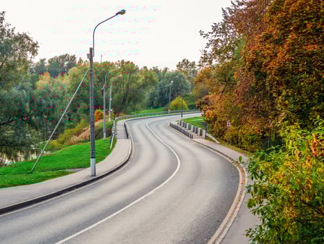 Winding highway. A landscape picture of highway rolling in autumn photo