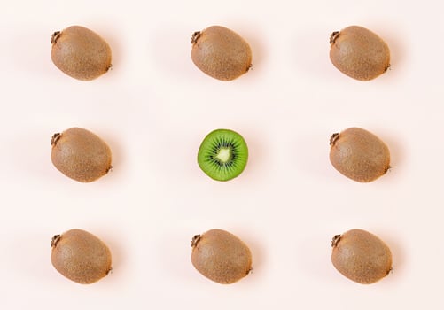 Kiwi fruit on wooden background. Pattern with juicy kiwifruit photo