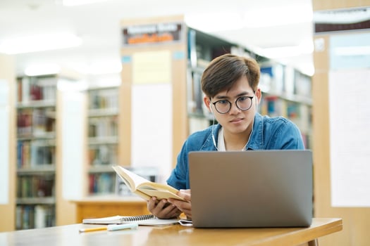 Student studying at library. photo