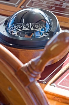 Boat Detail - Steering Wheel and Compass photo