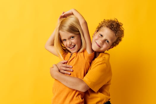 Portrait of cute children casual wear games fun together posing isolated background photo