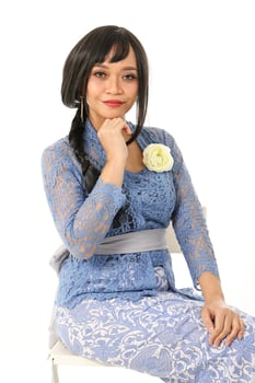 South east Asian Malay race ethnic origin woman wearing dress costume blue kebaya multiracial community on white background photo