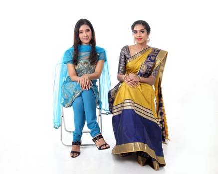 Two South east Asian Indian race ethnic origin woman wearing Indian dress costume sharee and salwar kameez multiracial community on white background photo