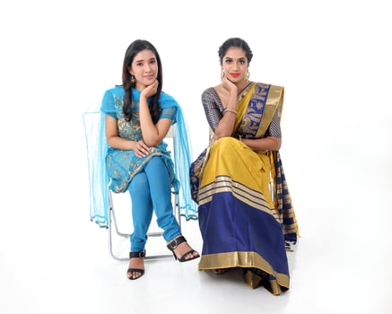 Two South east Asian Indian race ethnic origin woman wearing Indian dress costume sharee and salwar kameez multiracial community on white background photo