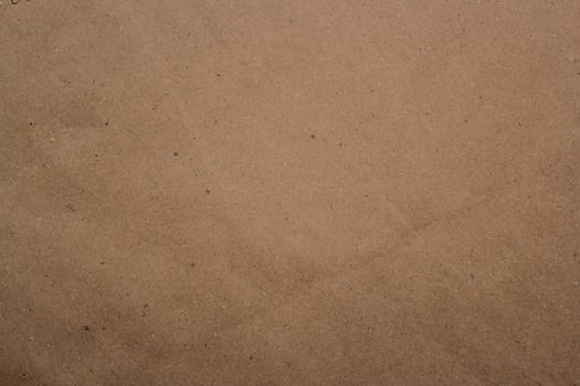 Brown paper texture close detailed background, shiny brown paper surface photo