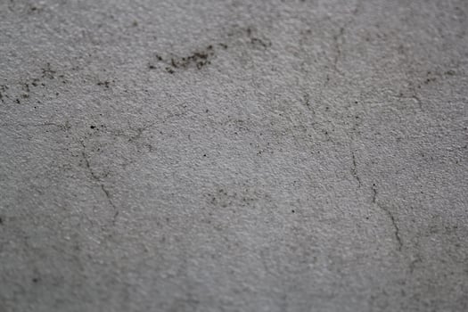 Cracked concrete wall surface, solid soil wall background, cement backdrop photo
