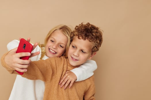 Little boy and girl hug entertainment selfie posing friendship childhood unaltered photo