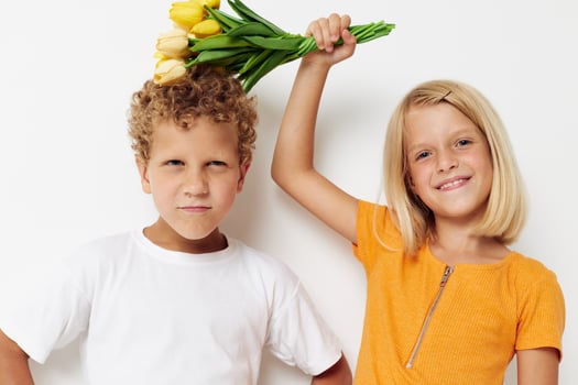 Small children with a bouquet of flowers gift birthday holiday childhood lifestyle unaltered photo