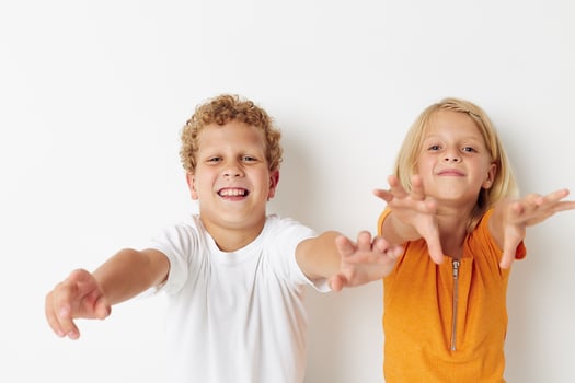 Cute preschool kids posing hand gesture smile casual wear isolated background unaltered photo