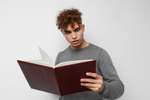 young guy with book learning education photo
