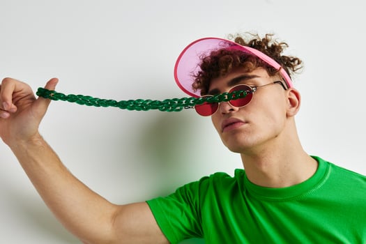 handsome young man green t-shirt decoration fashion glasses Lifestyle unaltered photo