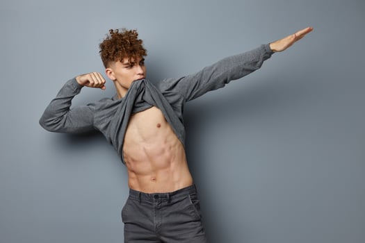 handsome young man sexy posing self confidence isolated background photo