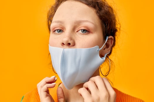 portrait of a young woman protective medical mask fun posing fashion isolated backgrounds unaltered photo