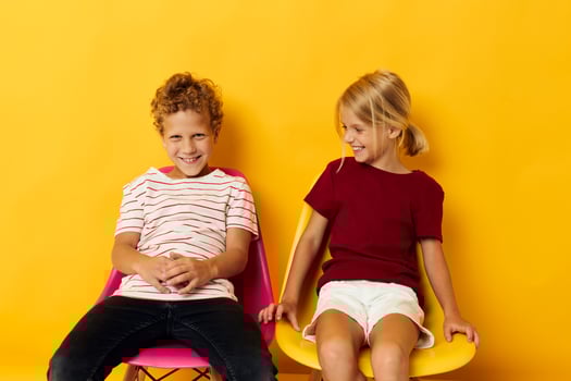 Portrait of cute children smiling and posing in casual clothes against isolated background photo