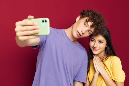 Man and woman modern style emotions fun phone isolated background photo
