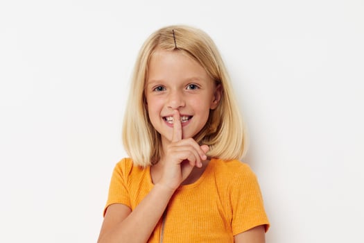 cute little girl with blond hair basing fun childhood photo