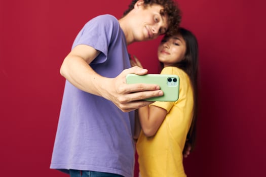 a young couple take a selfie posing hug isolated background photo