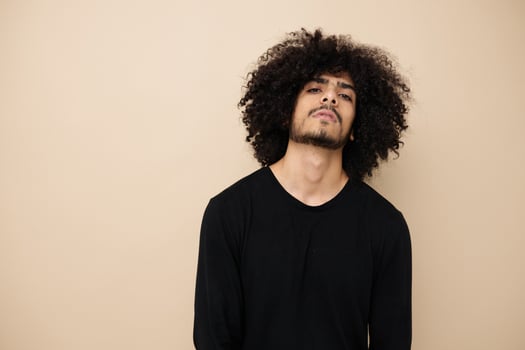 Attractive man in a black sweater hand gesture Lifestyle unaltered photo