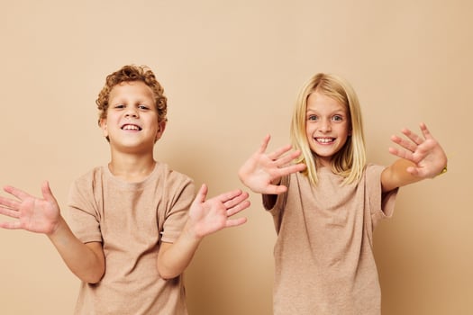 Cute stylish children gesticulate with their hands together Lifestyle unaltered photo