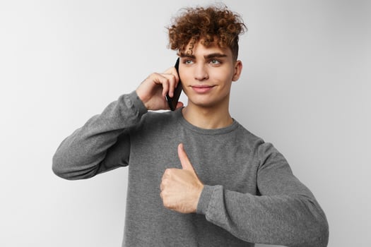 stylish guy with a phone in hand communication isolated background photo