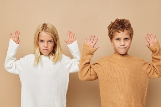 Cute stylish children hug entertainment posing friendship beige background photo