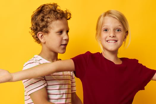 cheerful children casual wear games fun together isolated background photo