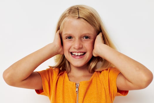 girl with blond hair gesture with hands posing close-up photo