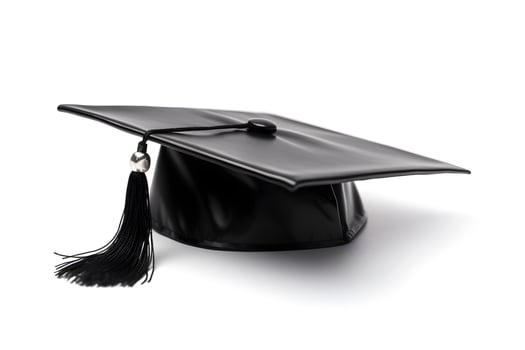 A graduation cap with a tassel isolated on white photo