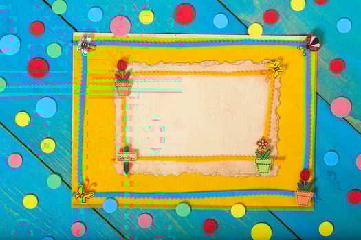 Yellow felt fabric on a wooden surface.Top view photo