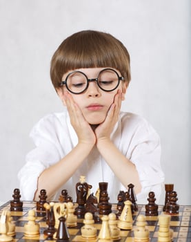 Boy is playing chess photo