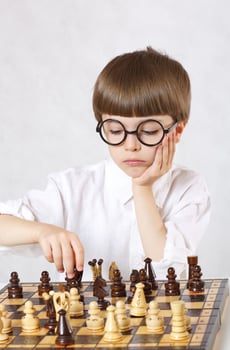 Boy is playing chess photo