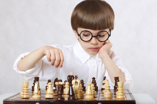 Boy is playing chess photo