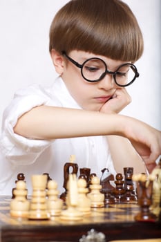 Boy is playing chess photo