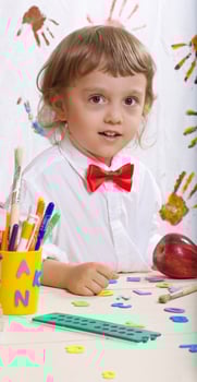 Boy of four years in white shirt with red bow photo